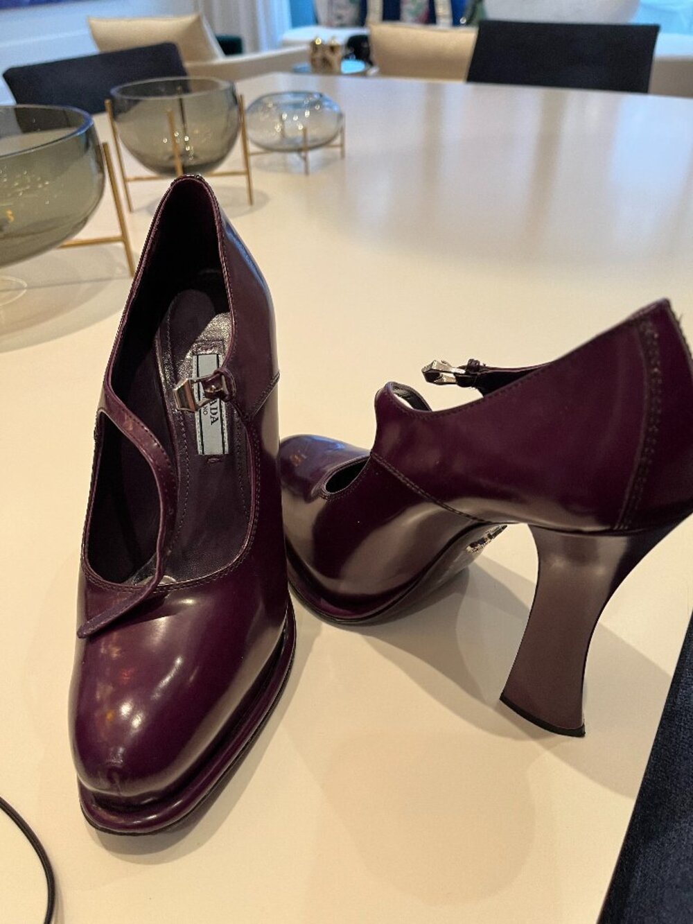 Prada burgundy leather Mary Jane-style pumps with the sculpted/block heel.